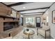 Spacious living area showcasing a brick fireplace and a charming entryway at 1716 Westwood Dr, Anderson, IN 46011
