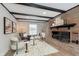 Cozy living room featuring a brick fireplace and comfortable seating at 1716 Westwood Dr, Anderson, IN 46011