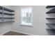 Bright pantry with ample shelving for storage at 1716 Westwood Dr, Anderson, IN 46011