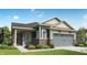 One-story home with blue siding, brick accents, and a two-car garage at 19877 Boulder Brook Ln, Westfield, IN 46074