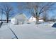 Detached garage and expansive snowy backyard at 2332 S Post Rd, Indianapolis, IN 46239