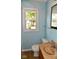 Bathroom with light blue walls, a vanity, and a toilet at 2606 13Th St, Columbus, IN 47201