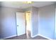 Simple bedroom with wood-look floors and neutral walls at 2606 13Th St, Columbus, IN 47201