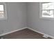 Well-lit bedroom with two windows and wood-look floors at 2606 13Th St, Columbus, IN 47201
