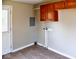 Laundry area with vinyl flooring and wood cabinets at 2606 13Th St, Columbus, IN 47201