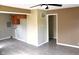 Living room with hardwood floors, neutral walls, and laundry access at 2606 13Th St, Columbus, IN 47201
