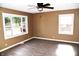 Living room with hardwood floors, neutral walls, and large windows at 2606 13Th St, Columbus, IN 47201