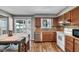 Kitchen with wood cabinets, tiled backsplash, and stainless steel appliances at 280 Christina Dr, Whiteland, IN 46184