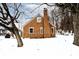 Brick home with snow covered yard at 312 Green St, Plainfield, IN 46168