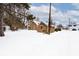 Brick duplex covered in snow, with a spacious yard at 312 Green St, Plainfield, IN 46168