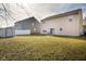 Spacious backyard with shed and neighboring houses at 3721 Rinehall Dr, Indianapolis, IN 46235