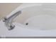 White bathtub with chrome fixtures at 3721 Rinehall Dr, Indianapolis, IN 46235