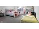 Spacious bedroom with a queen bed and additional sleeping space at 3721 Rinehall Dr, Indianapolis, IN 46235