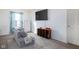 Spacious bedroom with a large TV and comfortable seating area at 3721 Rinehall Dr, Indianapolis, IN 46235