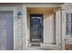 Front door entrance with a storm door and small porch at 3721 Rinehall Dr, Indianapolis, IN 46235