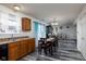 Open concept kitchen and dining area with modern flooring at 3721 Rinehall Dr, Indianapolis, IN 46235