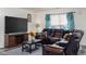 Living room features a large sectional sofa and TV at 3721 Rinehall Dr, Indianapolis, IN 46235