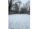 Snowy backyard with a wooden fence at 4715 E 33Rd St, Indianapolis, IN 46218