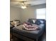 Bedroom with a bed, crib, and ceiling fan at 4715 E 33Rd St, Indianapolis, IN 46218