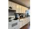 Kitchen with white cabinets, granite countertops, and white appliances at 4715 E 33Rd St, Indianapolis, IN 46218