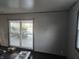 Bright living room with natural light and clean walls overlooking the backyard at 604 Gooseberry Ln, Greenwood, IN 46143