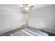 Bedroom with double doors and grey carpet at 6116 Prairie Stream Way, Columbus, IN 47203