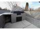 Outdoor brick kitchen featuring built-in shelving and a concrete patio at 6327 E 52Nd Pl, Indianapolis, IN 46226