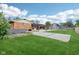 Spacious backyard featuring a large lawn, patio, and an outbuilding at 6327 E 52Nd Pl, Indianapolis, IN 46226