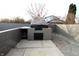Backyard area featuring a brick outdoor kitchen/fireplace, and a concrete patio at 6327 E 52Nd Pl, Indianapolis, IN 46226