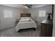 Spacious bedroom with carpeted floor, ceiling fan, and ample closet space at 6327 E 52Nd Pl, Indianapolis, IN 46226