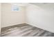 Minimalist bedroom features natural light and neutral walls at 6327 E 52Nd Pl, Indianapolis, IN 46226