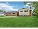 Charming two-story home with a well-maintained lawn and neutral exterior at 6327 E 52Nd Pl, Indianapolis, IN 46226