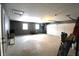 Spacious garage with overhead door and ample storage at 6327 E 52Nd Pl, Indianapolis, IN 46226