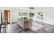 Bright living room featuring stylish furniture, hardwood floors, and a large window at 6327 E 52Nd Pl, Indianapolis, IN 46226