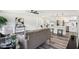 Open-concept living room with modern design, flowing into a kitchen area with updated appliances at 6327 E 52Nd Pl, Indianapolis, IN 46226