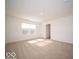 Sunlit bedroom features neutral carpet and view of backyard through window at 6349 Granby Dr, Whitestown, IN 46075