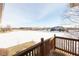 Deck overlooking a snowy field with distant houses at 6741 W Stonegate Dr, Zionsville, IN 46077