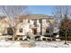 Two-story home with brick facade, balcony, and landscaping in winter at 6741 W Stonegate Dr, Zionsville, IN 46077