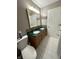 Bathroom featuring a double vanity and green countertop at 707 Spring Valley Ct, Indianapolis, IN 46231