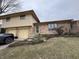 Brick and siding ranch home with attached two-car garage at 707 Spring Valley Ct, Indianapolis, IN 46231