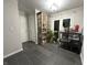 Foyer with dark tile floors and a view of the kitchen at 707 Spring Valley Ct, Indianapolis, IN 46231