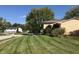 Neatly landscaped front yard with a manicured lawn at 707 Spring Valley Ct, Indianapolis, IN 46231