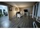 Spacious living room with hardwood floors, home office setup and a fireplace at 707 Spring Valley Ct, Indianapolis, IN 46231