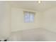 Bright bedroom with neutral walls, beige carpet, and window with curtains at 7910 Klay Ct, Mooresville, IN 46158