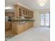 Eat-in kitchen with granite countertops and wood cabinets at 7910 Klay Ct, Mooresville, IN 46158