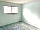 Bedroom with a single window and blue carpeting at 8104 Cheswick Dr, Indianapolis, IN 46219