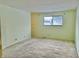 Spacious bedroom features carpet floors and a bright window at 8104 Cheswick Dr, Indianapolis, IN 46219