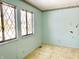 Bedroom featuring light blue walls, neutral carpet and two windows with diamond pattern at 8104 Cheswick Dr, Indianapolis, IN 46219