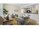 Open living room with gray couches and kitchen island at 818 W Broadway St, Alexandria, IN 46001