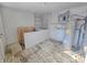 Unfinished basement with water heater and storage shelves at 107 E Garfield St, Alexandria, IN 46001